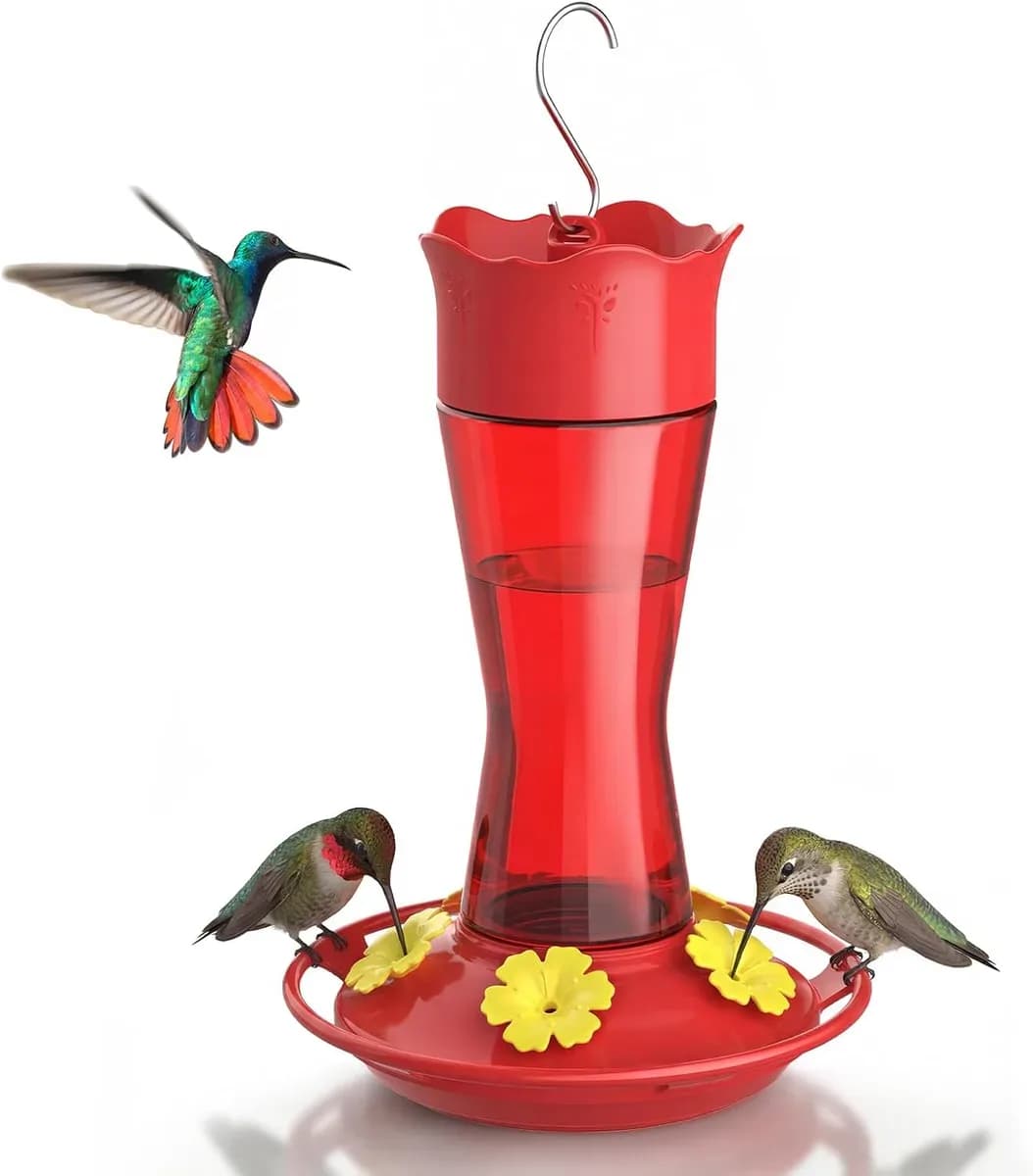 Red glass hummingbird feeder ready to hang outdoors