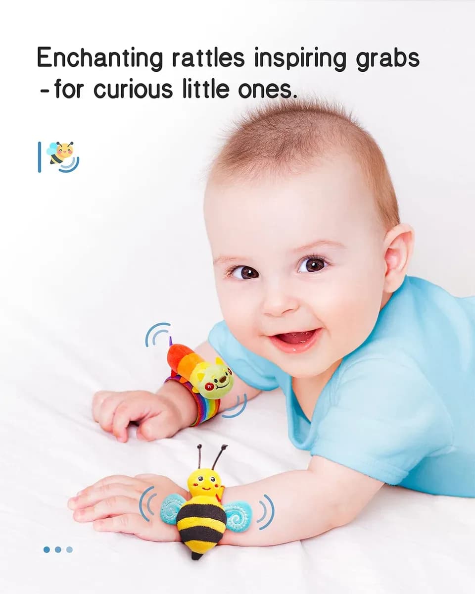 Baby grabbing one of the baby wrist rattles