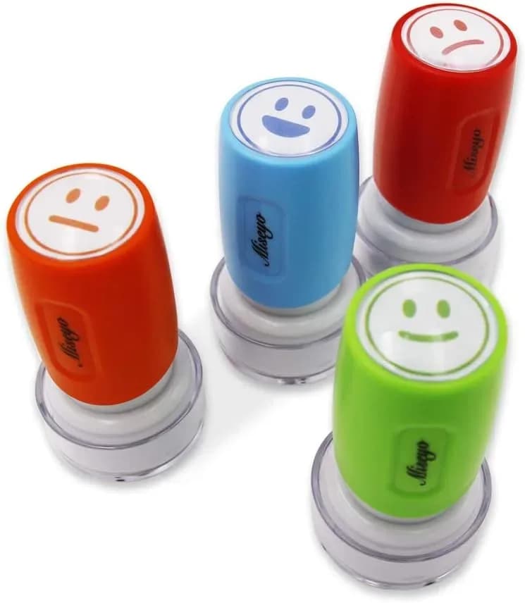 Self-inking teacher smiley face stamp ready to press