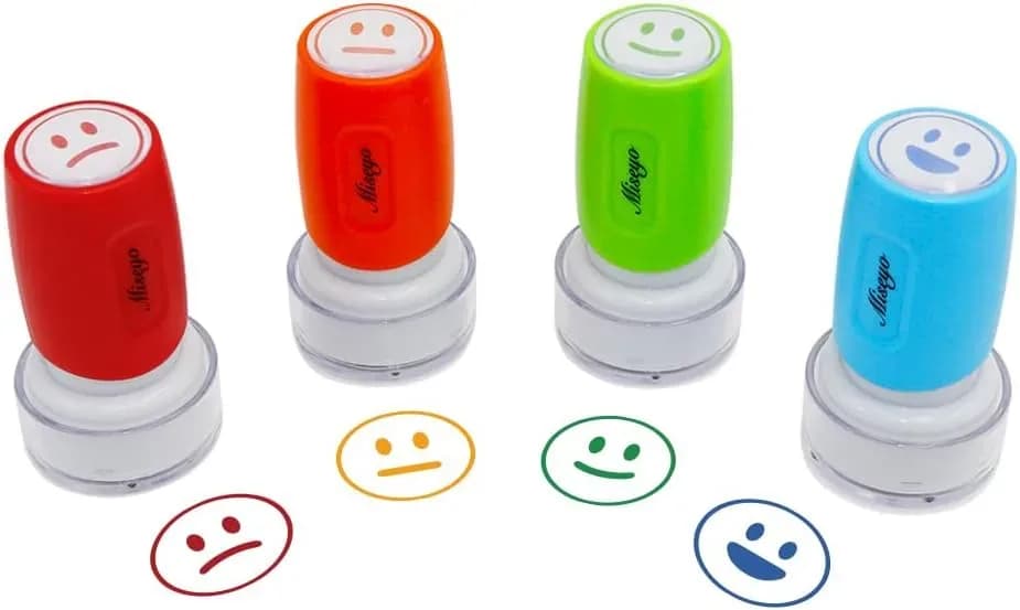 Teacher smiley face stamp set with protective caps on