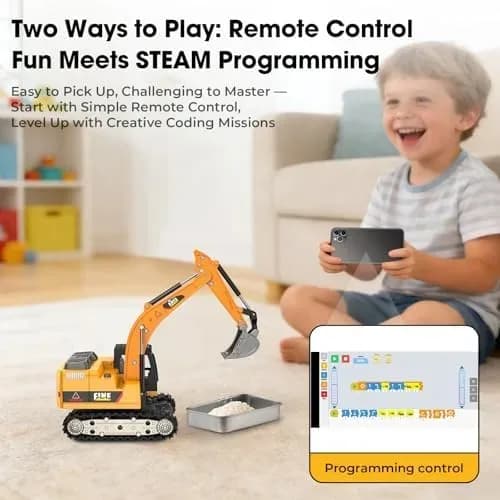 Mini RC excavator being driven on a tabletop worksite