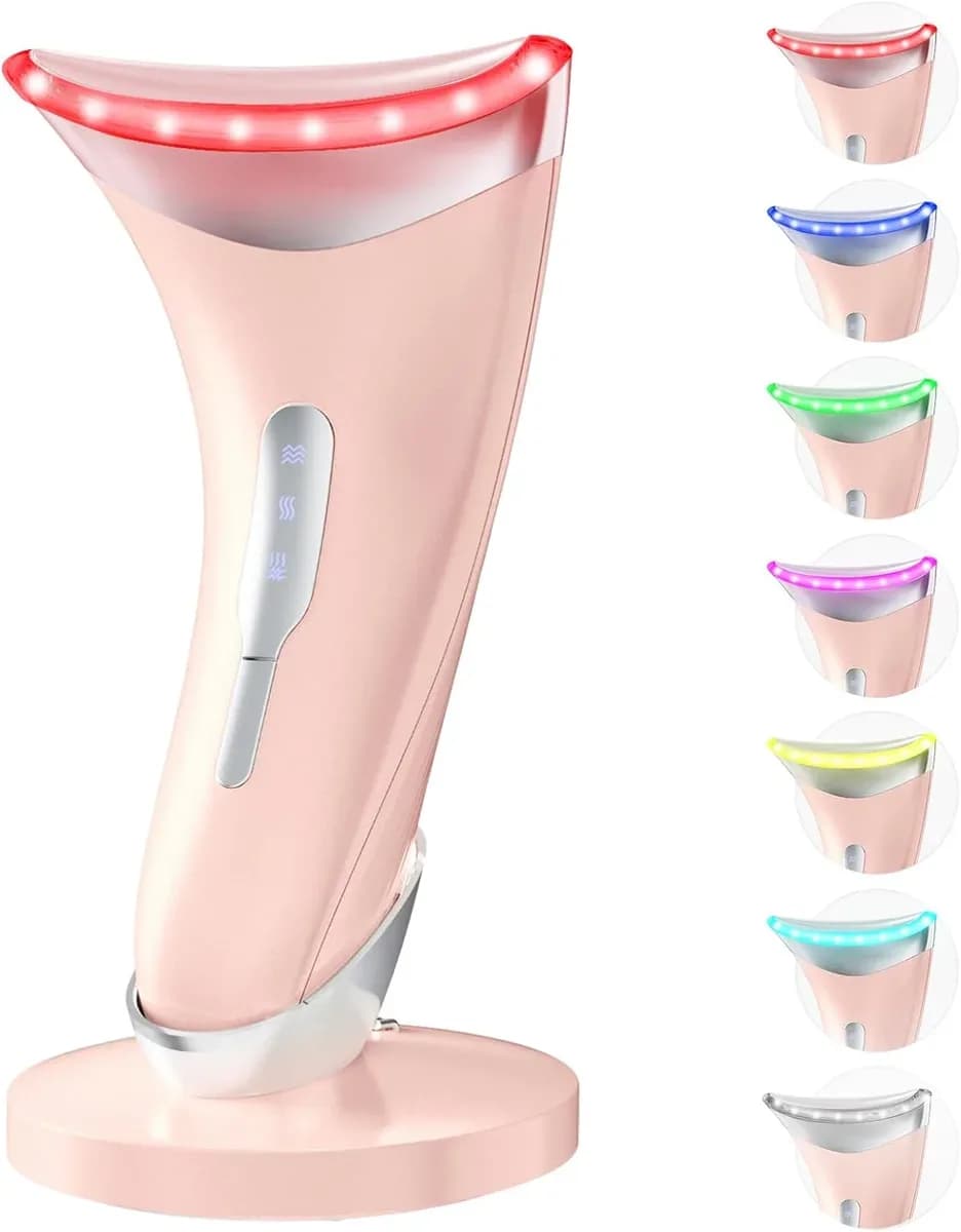 Glossy pink LED face massager standing on a charging stand