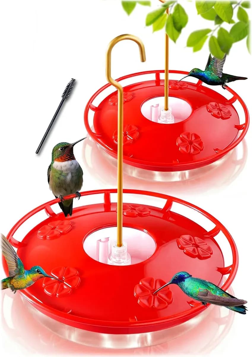 Two red saucer hummingbird feeders with hummingbirds feeding