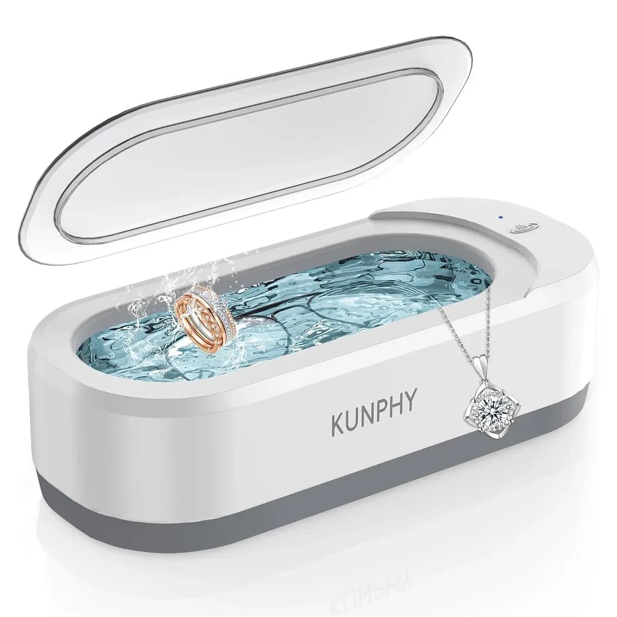 White ultrasonic jewelry cleaner with a necklace soaking in the tank